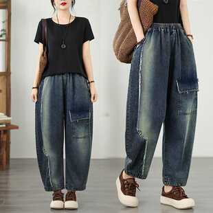 Real Shot of In-Stock Plus-Size Jeans with Large Pockets, Creative Raw Hem Design, and Elastic Waist