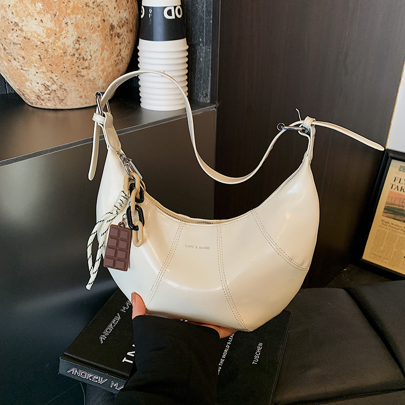 Transfronterizos coreanos perezosos bolsas de brazo de cera nicho bolsas de cuerno de piel de cera 2026 nuevas bolsas de brazo diarias mujeres