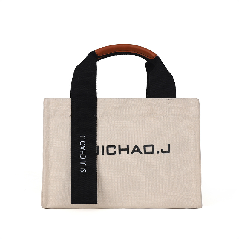 Bolsa personalizada al por mayor, bolso de mano retro de moda, estilo coreano nuevo, bolso de mano con letras impresas en color sólido para mujer