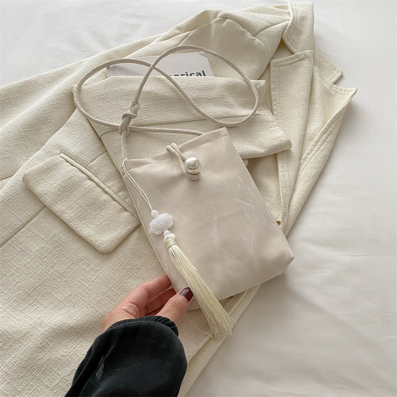 Nueva bolso chino para mujeres 2024 verano nuevo estilo nacional bolso de mano pequeño bolso ligero con cheongsam perla bolso móvil