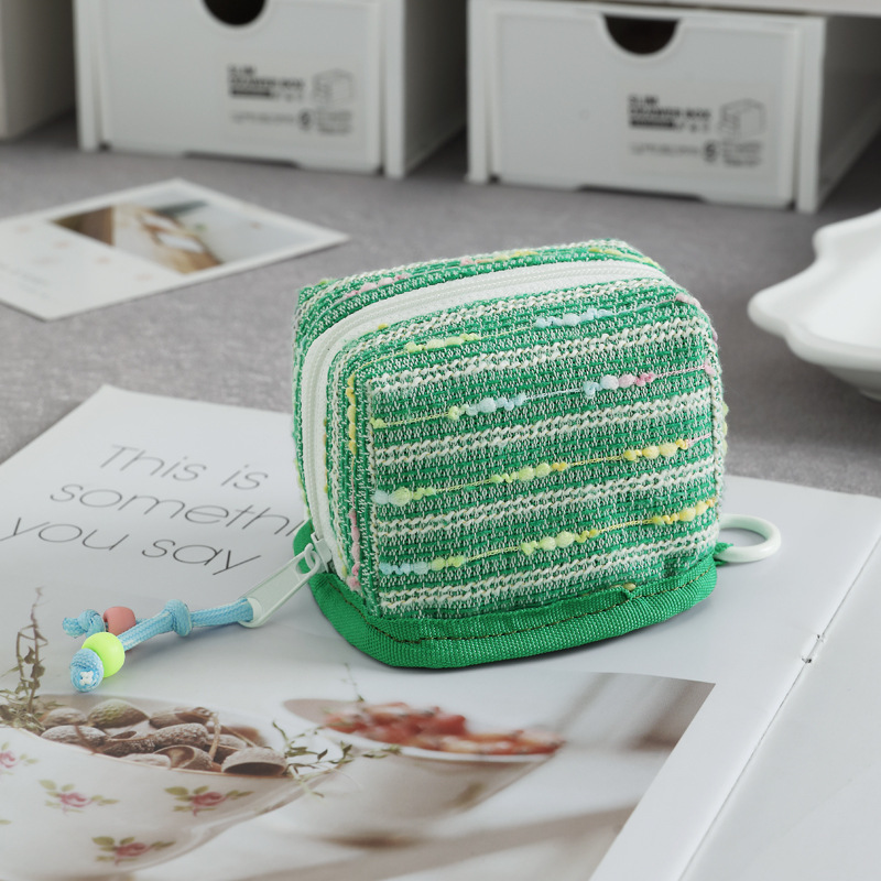 Nuevo mini bolso de llaves de viento de fragancia bolso de cambio lápiz labial de almacenamiento universal para el corazón de la niña conveniente para salir y almacenar en uno