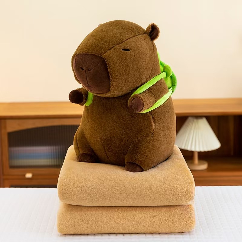 Caricatura capibara almohada manta dos en uno Carpibara cojín aire acondicionado es de doble uso niños siesta manta regalo