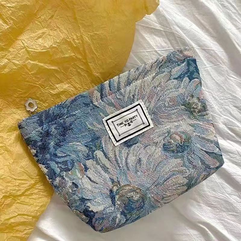 Diseño original de nicho blanco y negro temperamento Jacquard lienzo maquillaje bolsas de mano estilo retro simple flores convenientes