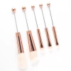 Gold brush handle + white bristles