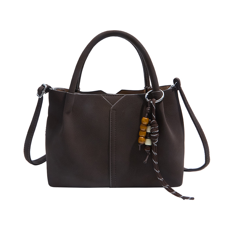 Bolso de mano de alta sensación de moda bolso de balde de mujer 2025 invierno retro simple bolso de hombro temperamento mochila de viaje