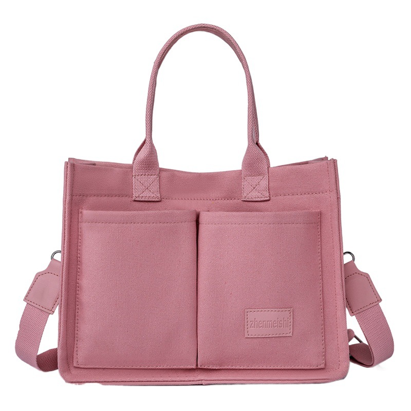 Principios de la primavera color puro popular bolso de mano 2024 nuevo estilo coreano simple bolso casual gran capacidad bolso de hombro de las mujeres moda