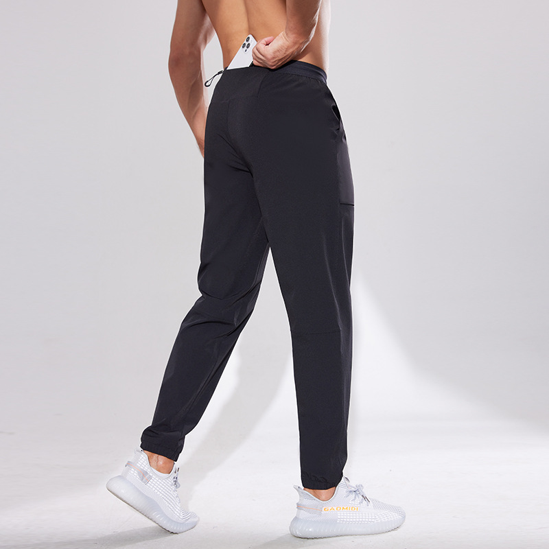 Pantalones deportivos Otoño de los hombres al aire libre de secado rápido pantalones sueltos de nylon tejidos tobillo atado pantalones casuales fitness correr Pantalones