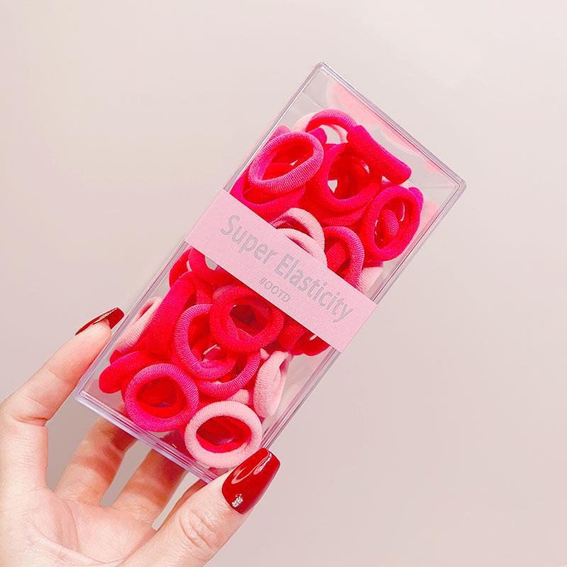 Asequible caja de almacenamiento de Corea del Sur de los niños pequeño tamaño cabeza cuerda bebé toalla anillo no duele pelo cabeza cuerda macaron pelo anillo