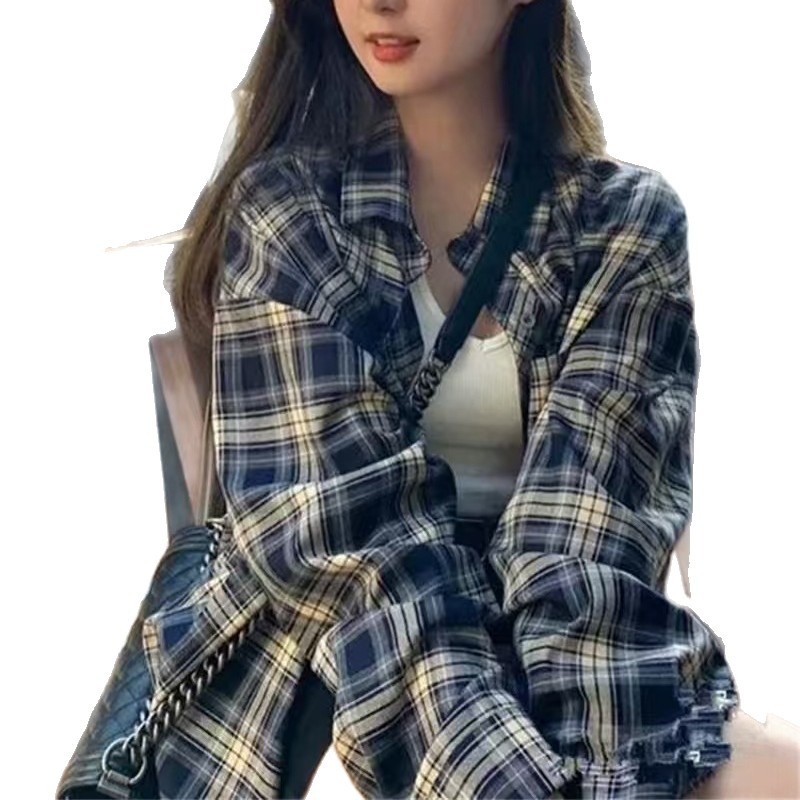 レトロな韓国の格子のシャツの女性の新型の香港風のカジュアルなファッションのデザイン感のシャツの百合は底の長袖のコートを打ちます。