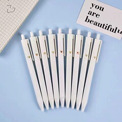 カップルの表情のペンは中性のペンの8つの表情の包みのつや消しのペンの0.5mmの黒色を押して筆の赤い本を押します。