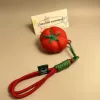Tomato with red rope