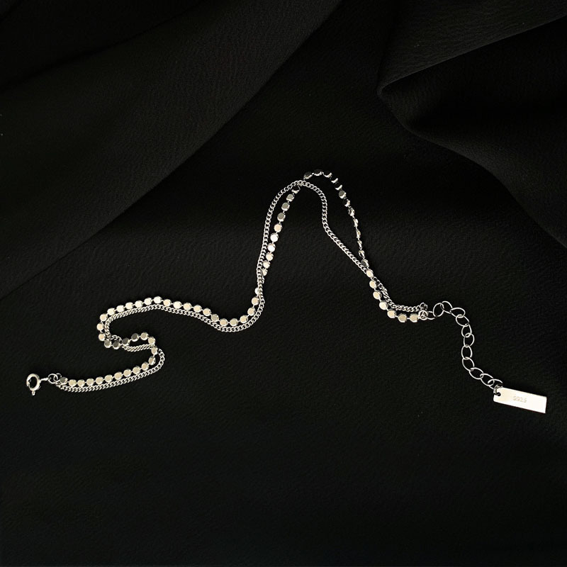 Cavigliera da donna con ciondoli a sole e dischi, gioiello moda_voghion.com