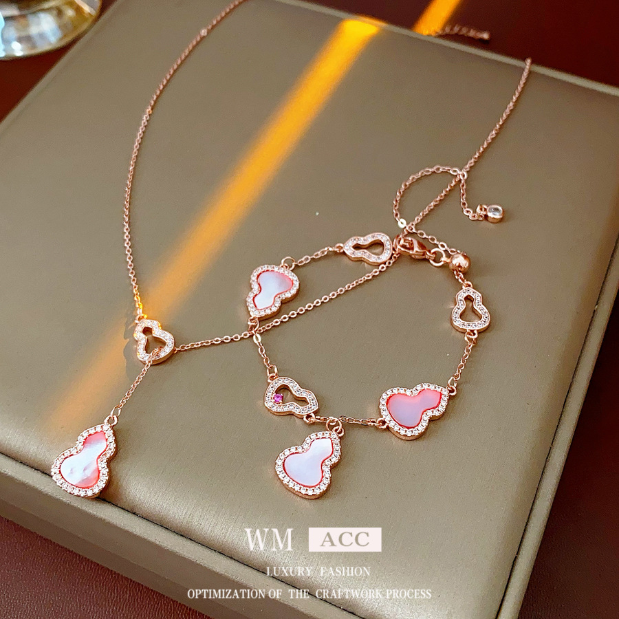 Conjunto de colgantes de calabaza con carcasa hueca de circonita, joyería vintage exquisita y elegante con un toque de alta gama, diseño único, versátil.