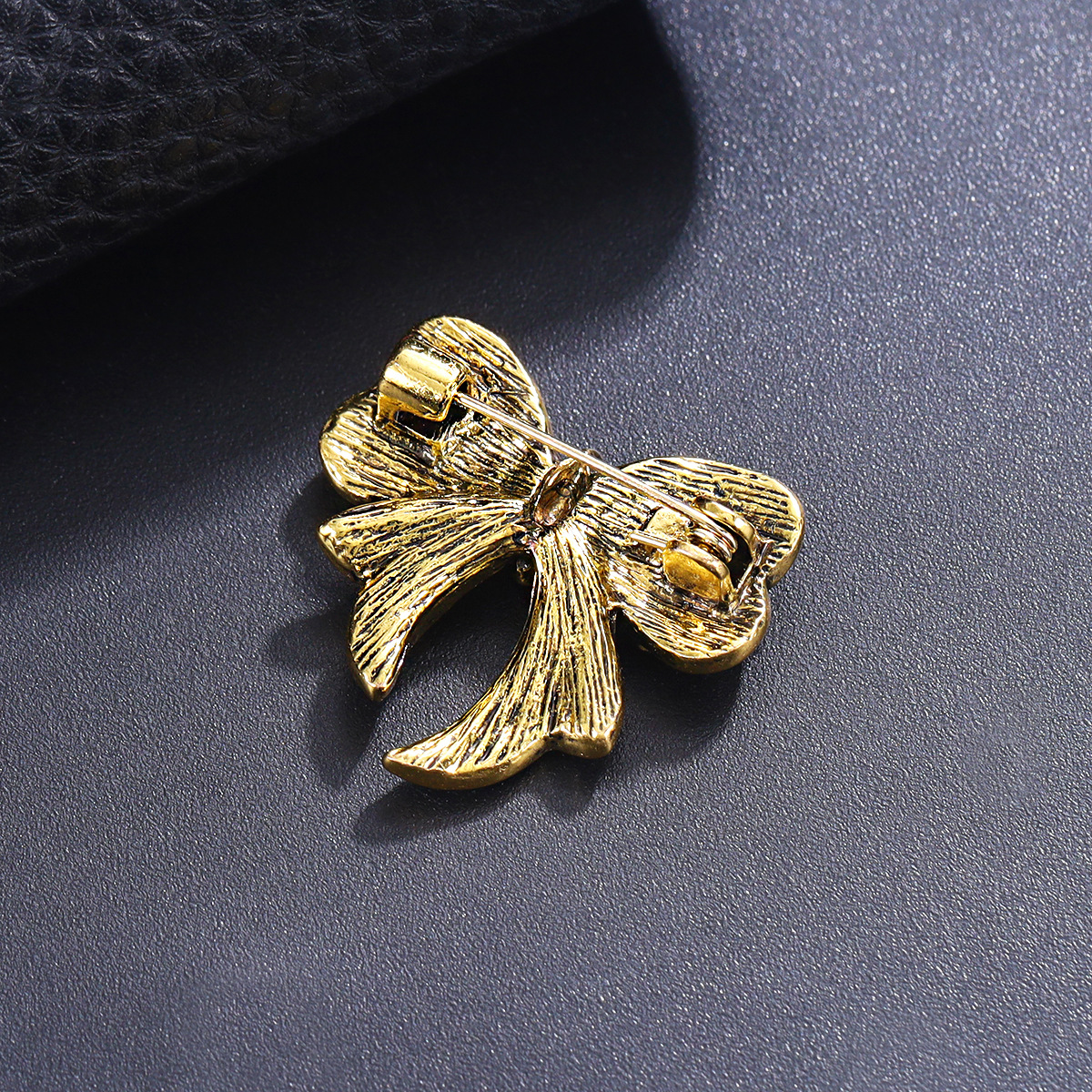 Sophisticated cute metal brooch with bow