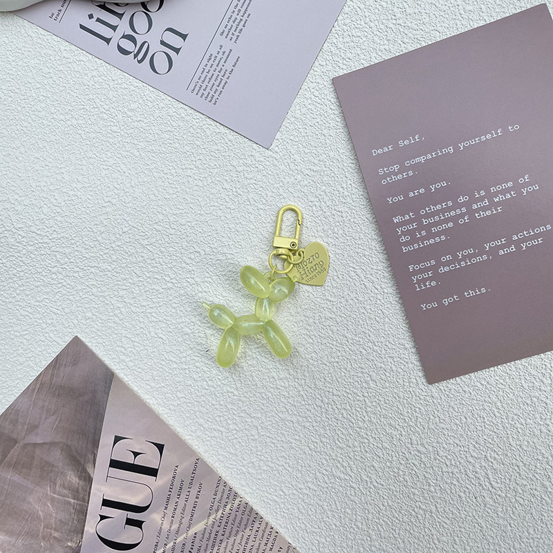 Pequeño Libro Rojo mismo lindo jalea globo láser perro llavero colgante colorido cachorro de dibujos animados teléfono llavero