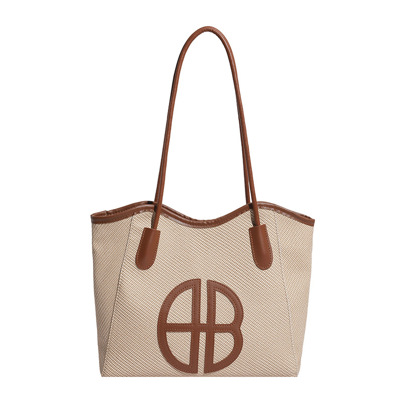 Bolsa de brazo de gran capacidad para viajar 2026 nueva moda bolso de mujer de alto nivel nicho bolso de hombro bolso especial para mujeres