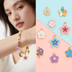特別なホットスタイルのカラフルな DIY フラワーアクセサリーオイルドリップ合金イヤリングデイジーブレスレットキーホルダーペンダントペンダント