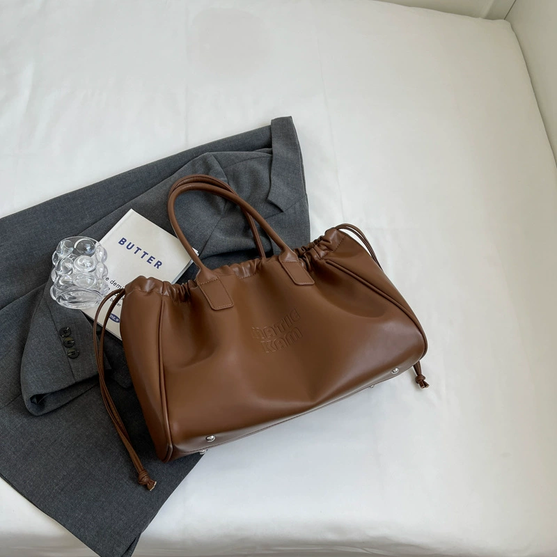 Universal small design shoulder bag, capacious one-shoulder bag, 2023 collection, genuine leather, drawstring