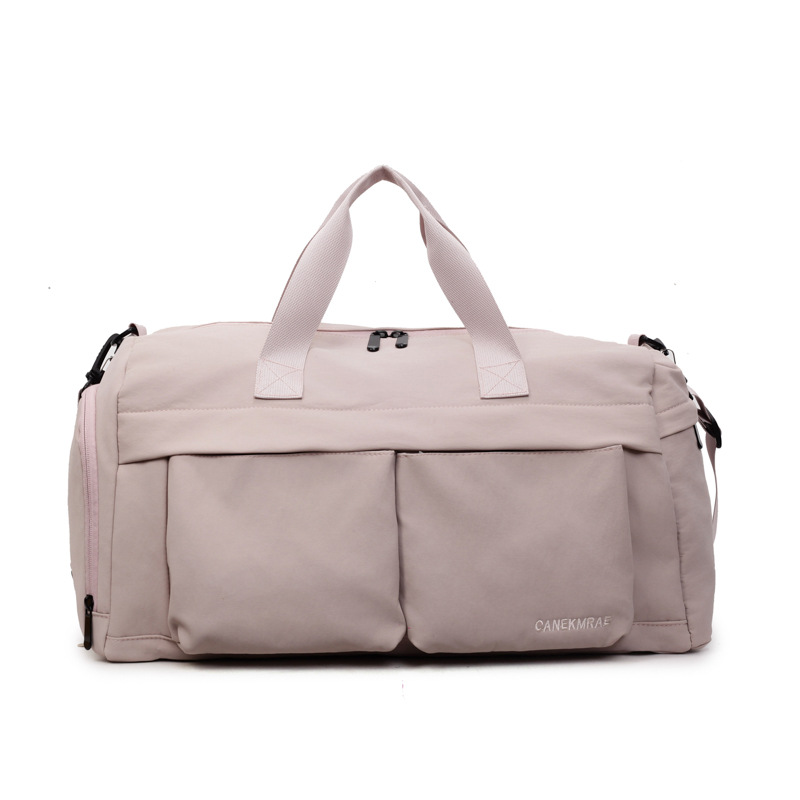 Nueva bolsa de viaje portátil simple y versátil, bolsa de equipaje de gran capacidad para mujeres, bolsa deportiva leve y casual de alta calidad.