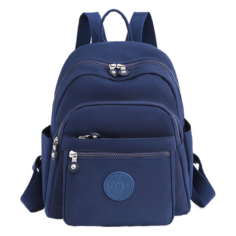 Nueva mochila informal para mujer al aire libre versión coreana tela Oxford pequeño bolso cuadrado transfronterizo multi-grilles mochila de moda al por mayor