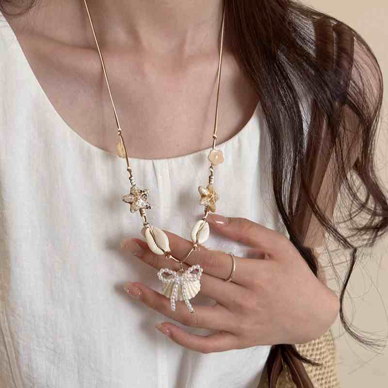 Cuerda de cera estrella de mar concha colgante de perlas collar vacaciones de verano estilo cadena de clavícula cadena de suéter de moda fresca y dulce mujer