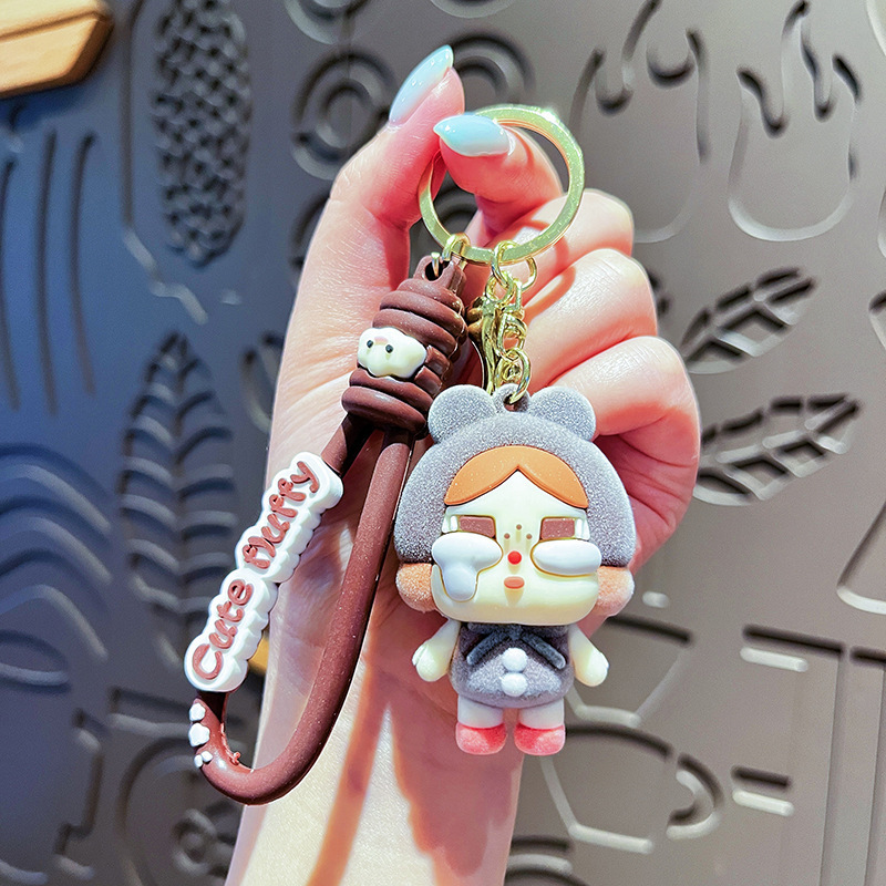 Nuevo llavero de bebé llorando, muñeca de lágrimas, bolso de muñeca, colgante, llavero de coche, colgante flocado de moda al por mayor