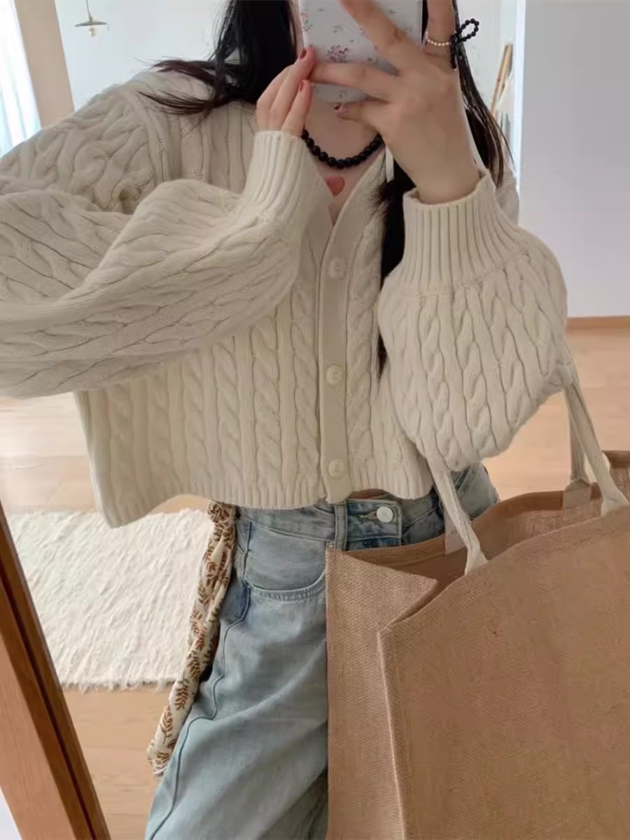 Corea del Sur Dongdaemun simple torcido corto de cintura alta jersey cardigan de punto para mujeres otoño y invierno nuevo suéter de manga de linterna pequeña