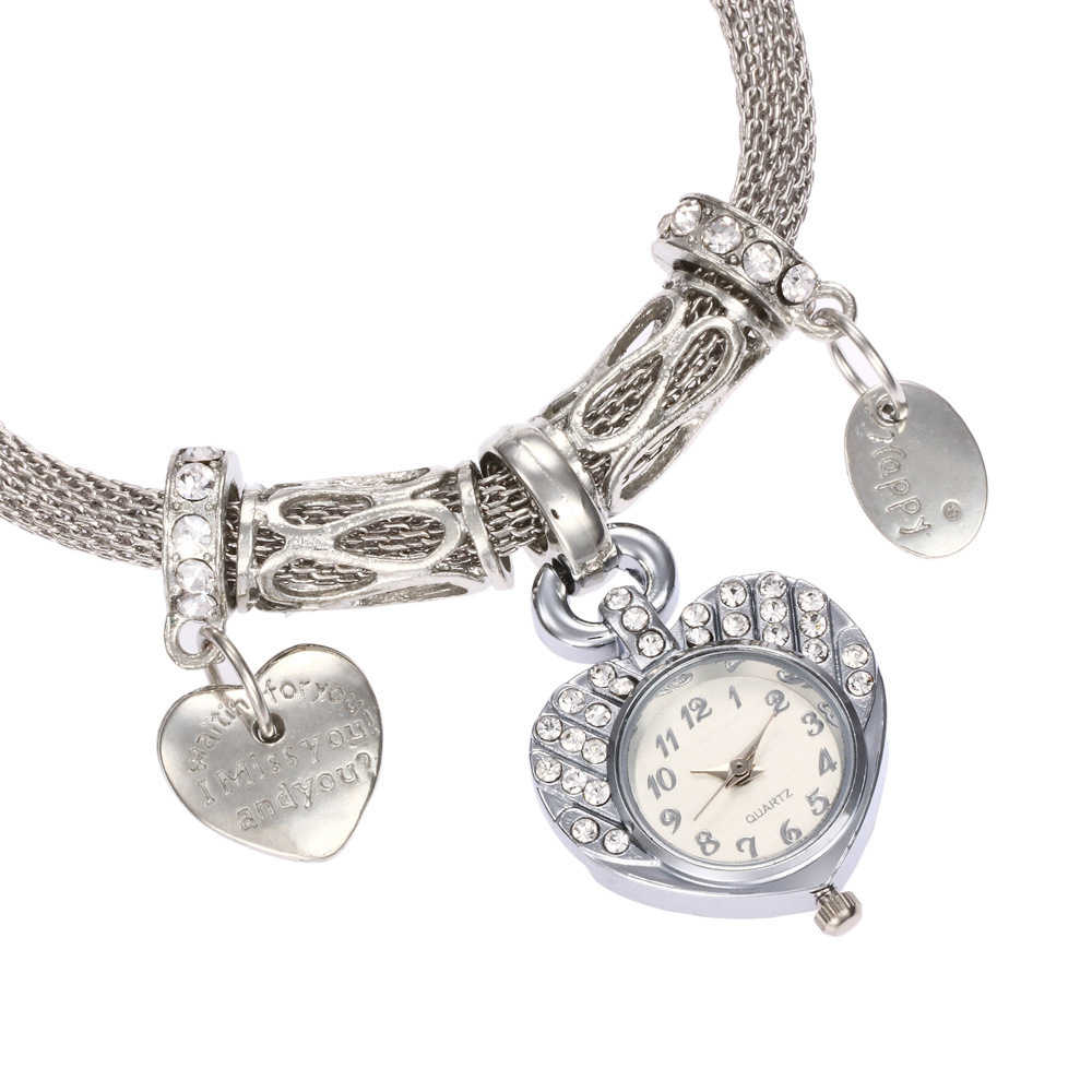 Reloj de pulsera de mujer ins moda Diamante Oro Corazón de melocotón reloj de temperamento decorativo estudiante femenina reloj de aleación de cuarzo