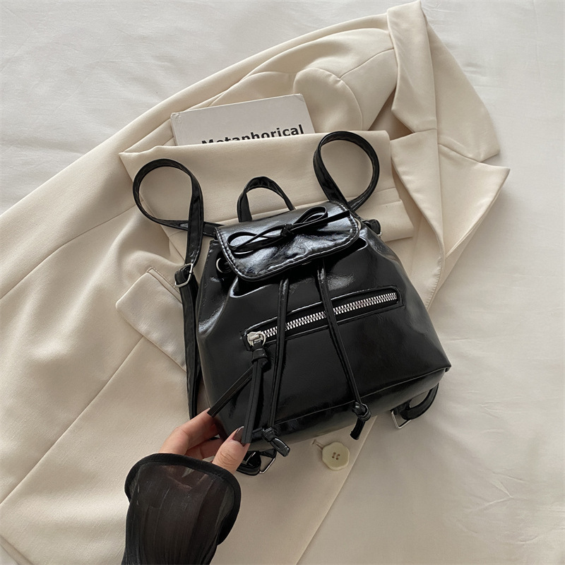 Mochila de nicho coreana para mujer, verano 2024, nueva mochila de moda, bolso de cubo portátil de un solo hombro de todo fósforo