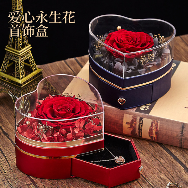 Acrylic ring heart shaped contains rose