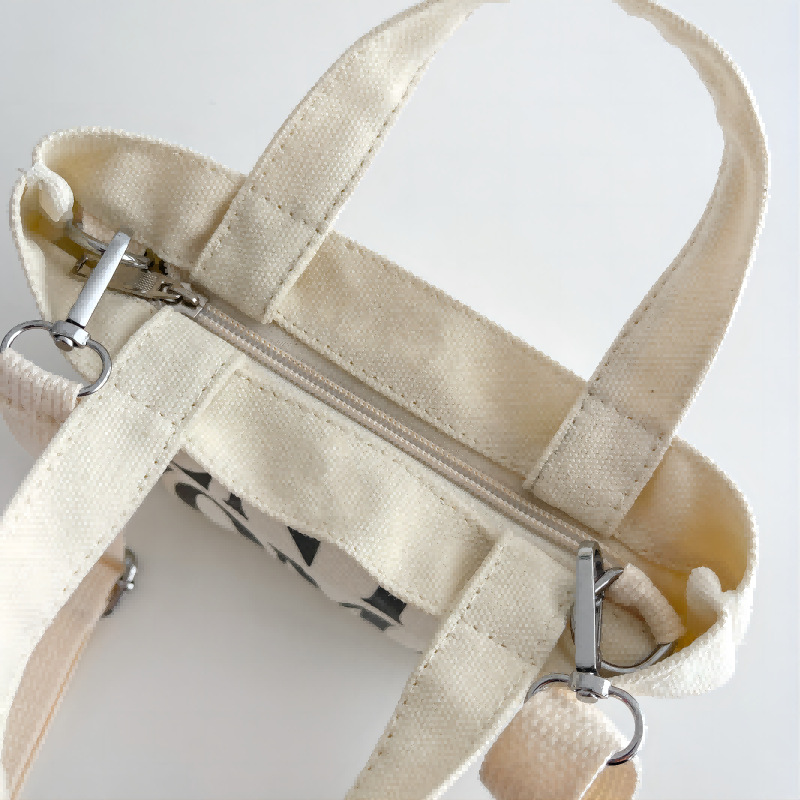 Venta al por mayor transfronteriza GW Tailandia Xiaoyou bolsa de lona diseño de nicho carta portátil de gran capacidad bolsa de mensajero del hombro