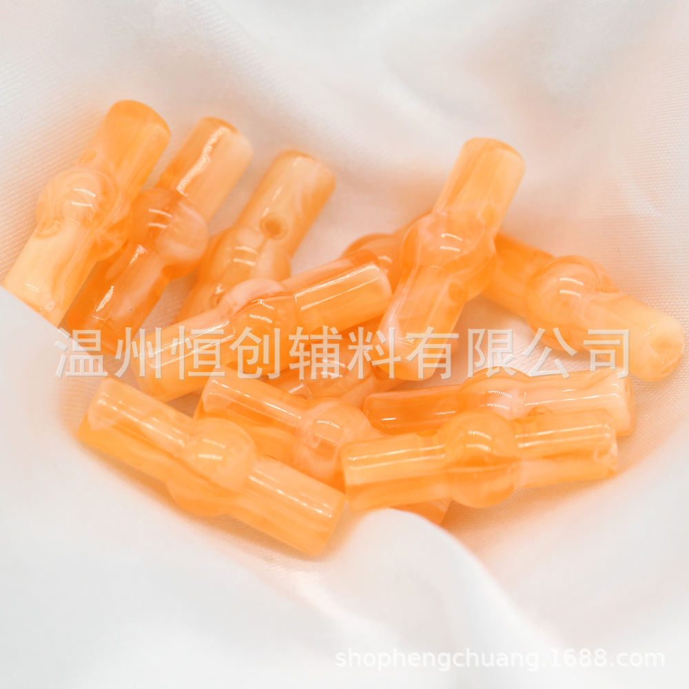 25x9mm brillante Hengchuang botón de resina cilíndrica de dos agujeros botón de estilo nacional suéter de punto botón de color de bricolaje al por mayor