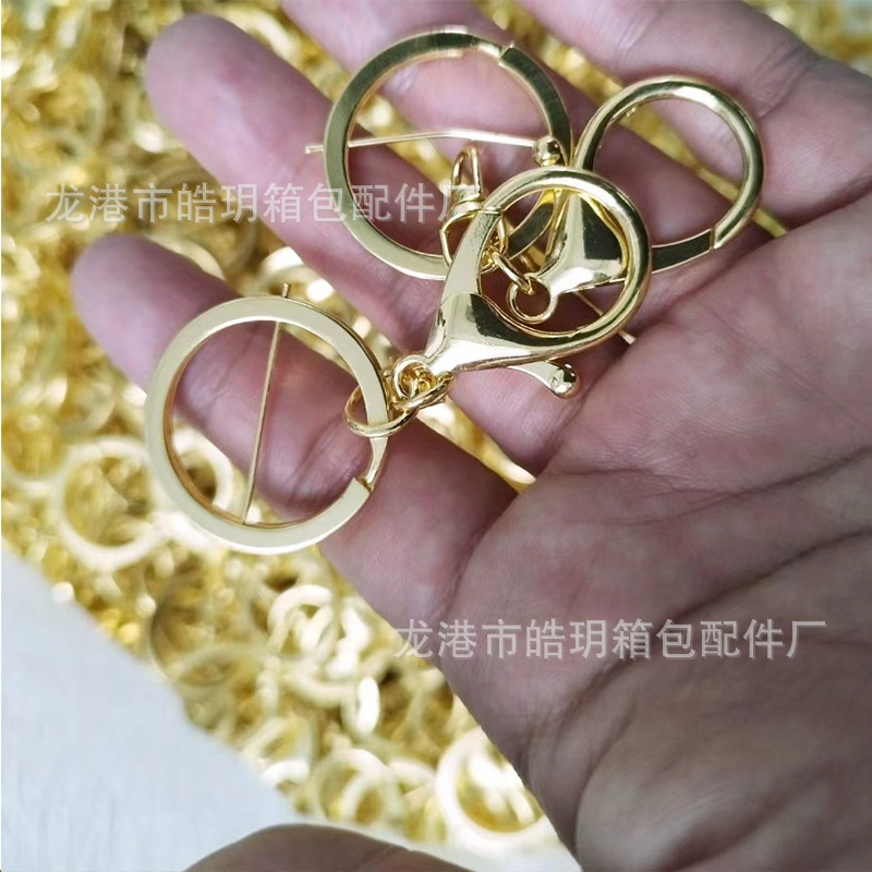 メーカーが提供しているロブスターボタンのキーホルダーは亜鉛合金部品の金属スプリングフックで、犬ボタンのフラットリングです。|undefined