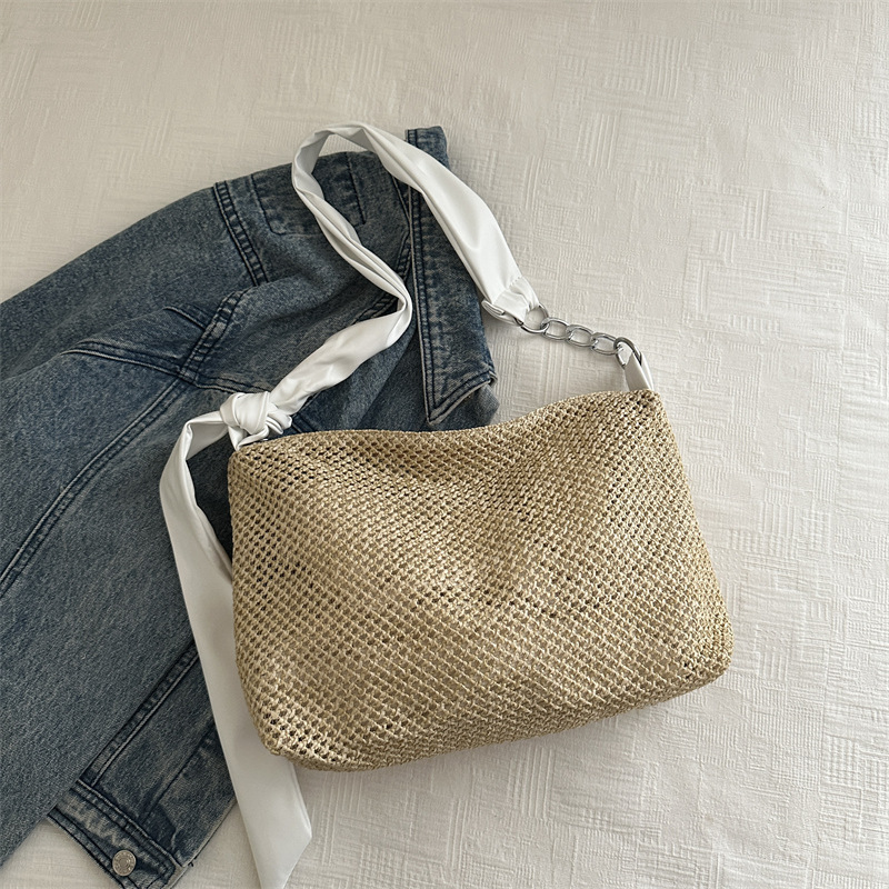 Bolsa de paja de moda coreana de gran capacidad para mujeres este año popular nicho diseño de banda ancha tejida de hombro bolsa de hombro