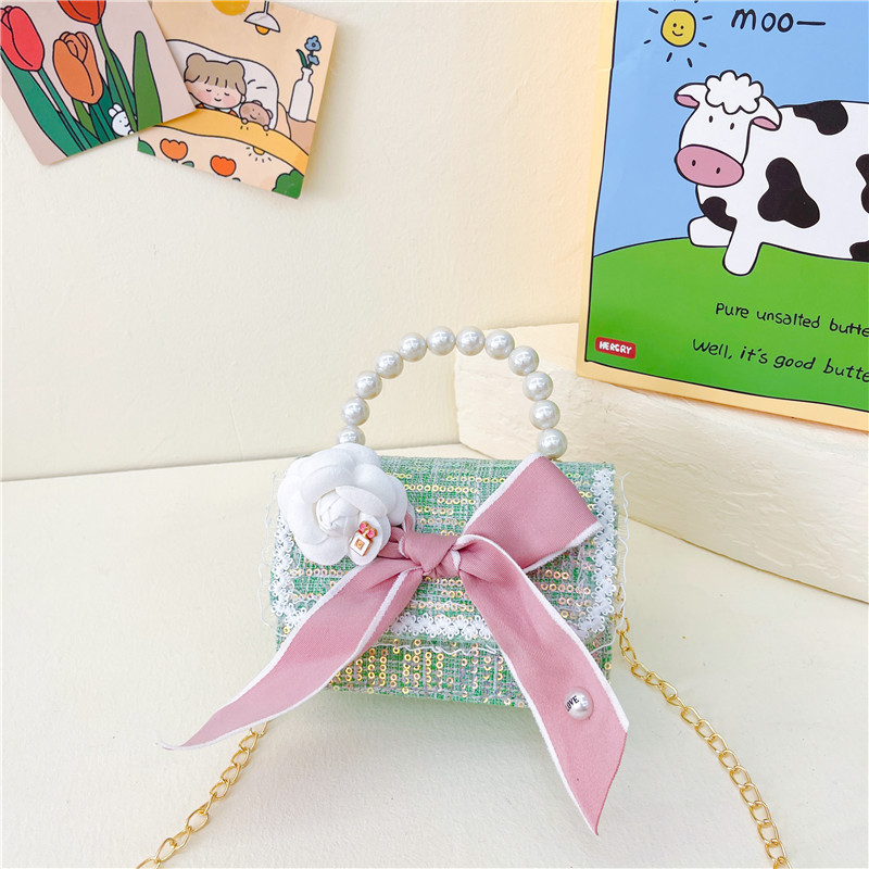 Bolso de los nuevos niños al por mayor bolso de princesa Linda pequeña flor arco accesorios bolsa versátil bolsa de mensajero de las muchachas