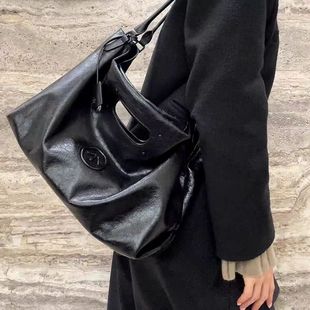 Leather capacious one-shoulder bag, tape