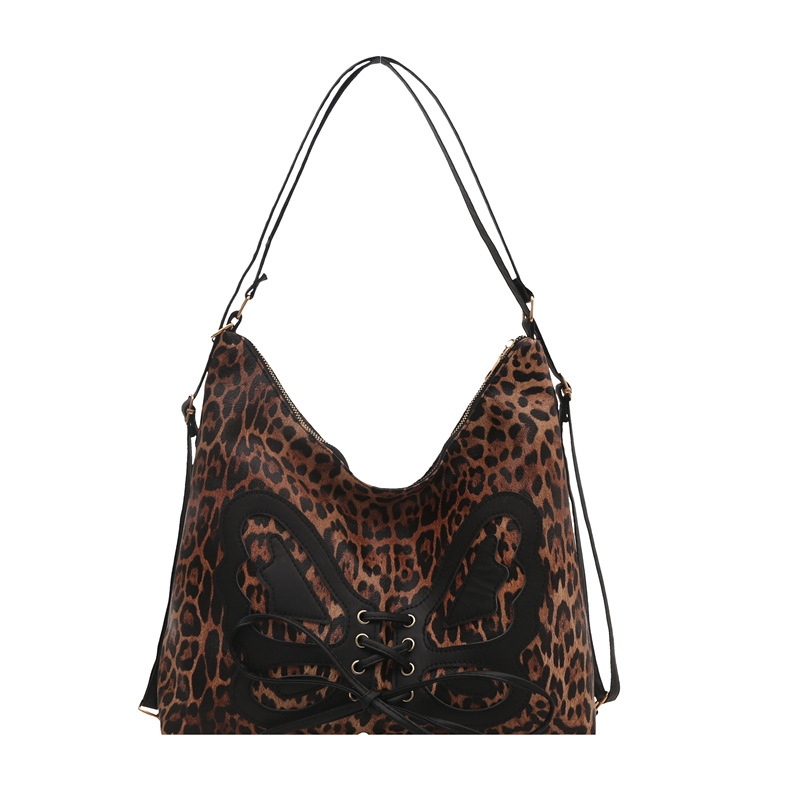 Mochila de arco de gran capacidad para mujeres 2025 primavera nueva mochila retro textura de viaje elegante bolsa de mano