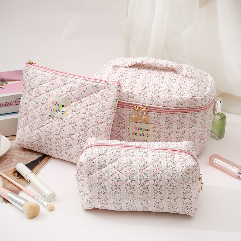Nuevos productos pequeños bolsas de maquillaje de gran capacidad de sensación de alta calidad conveniente tela de algodón de polietileno flores en la nueva bolsa de almacenamiento de cosméticos