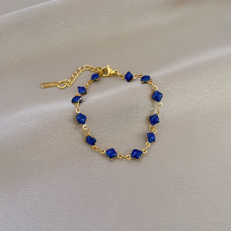 Pulsera de titanio [Acero de titanio de todo el cuerpo] Dongdaemun personalidad estilo simple Lucky Grass pulsera de cadena azul hembra Red rojo retro novias