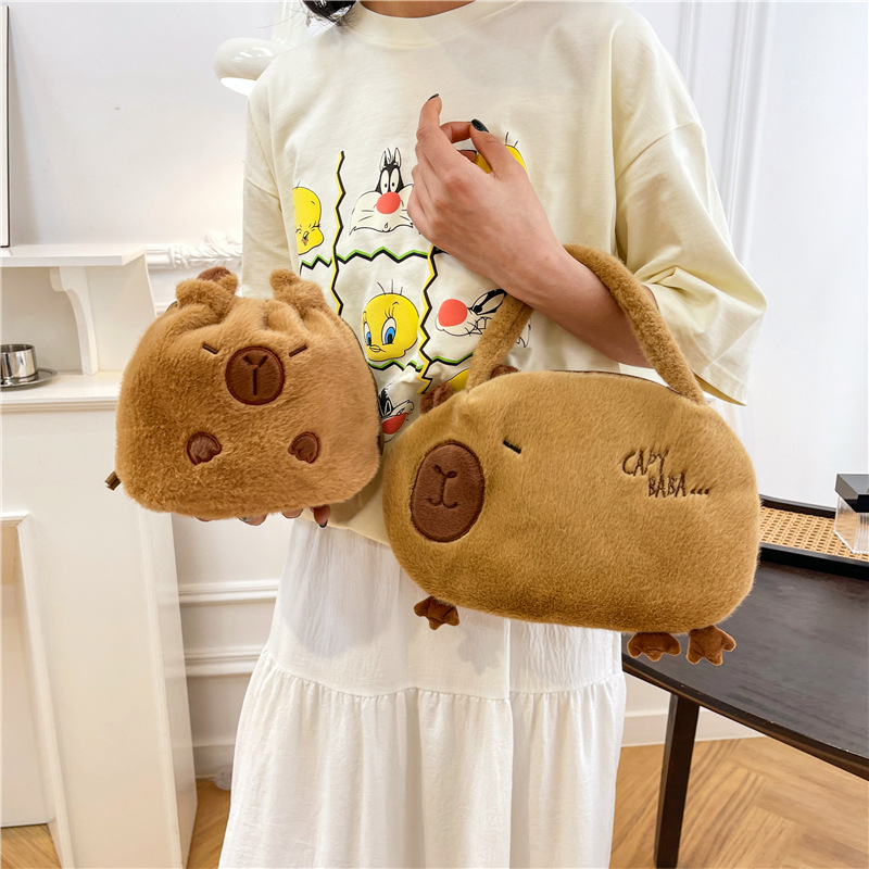 Bolso de peluche en línea para mujeres 2025 nuevo bolso de muñeca Capibara, bolso de cubo de mano lindo corazón de niña
