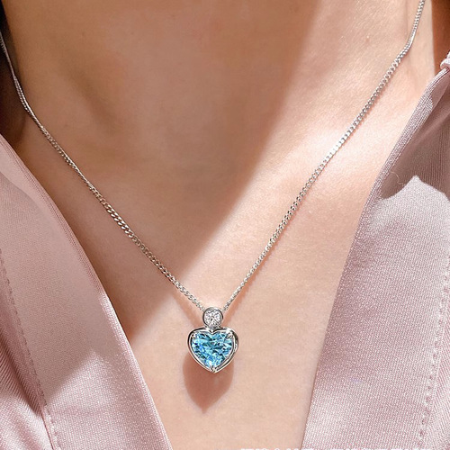 Heart-shaped pendant necklace for women with 2-carat blue diamond and aquamarine artificial diamonds, exuding a unique and sophisticated charm.