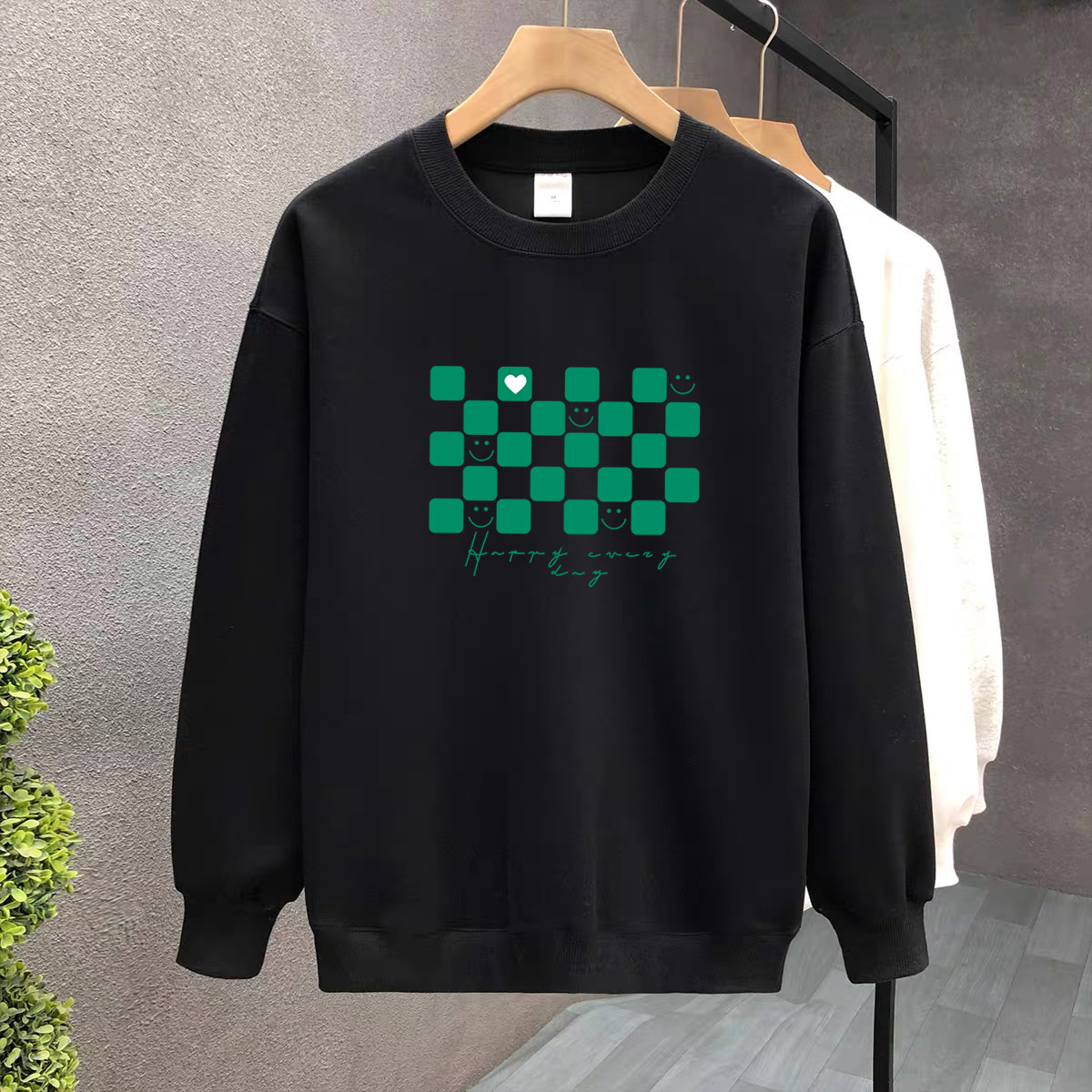 Suéter de algodón negro pesado de alta gama para mujeres 2025 otoño y invierno nuevo estilo europeo y americano camiseta de manga larga fondo suéter de estudiante