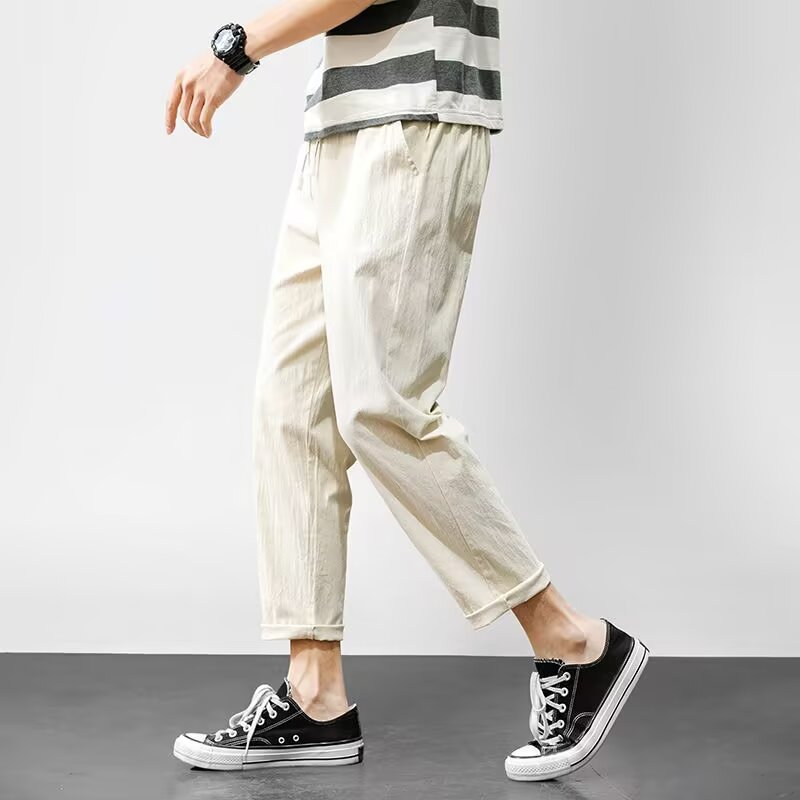 Pantalones casuales para niños otoño nueva marca de moda ropa de trabajo recta suelta nueve puntos pantalones largos deportivos 2025 primavera y otoño ropa de hombre