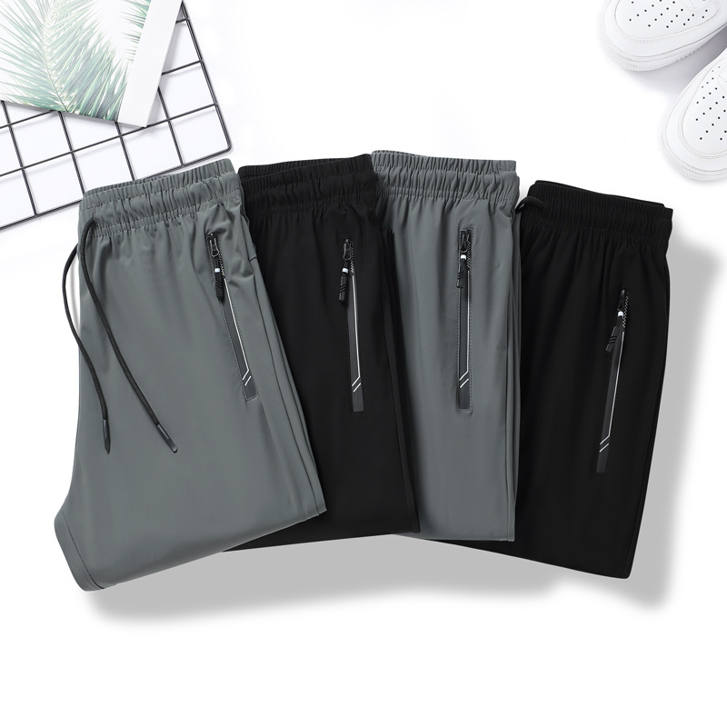 Pantalones de verano de hielo de tamaño grande para hombres pantalones deportivos de barril recto, piernas de ángulo plano sin quemar, secado rápido pantalones casuales al por mayor