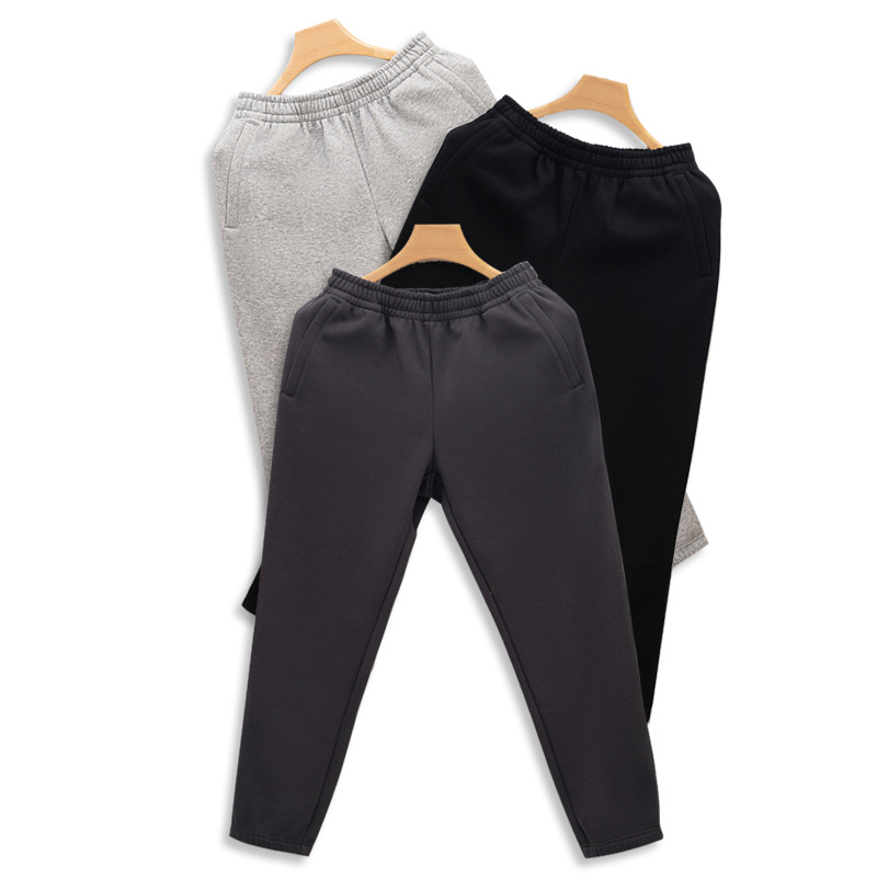 Nueva cremallera bolsa de lana forrado pantalones de chándal de los hombres y las mujeres otoño y el invierno suelto nuevo tobillo-atado de algodón casual espesado caliente pantalones hombres