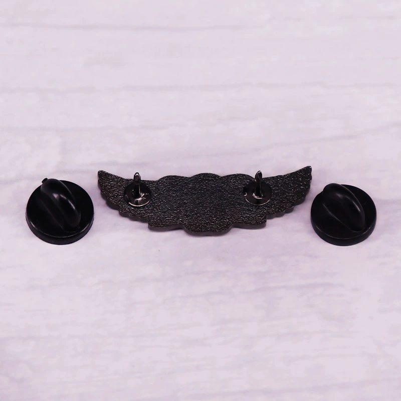 Three winged skull chest needle badges