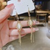 Long fashionable universal earrings with tassels, 2024 years, cat's eye, internet celebrity