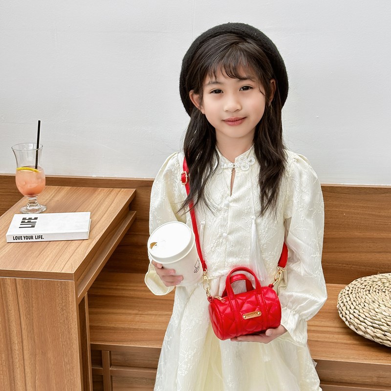 Bolsas infantiles simples de color sólido, bolsas de mini barril de moda coreana, 2025 nuevas bolsas para bebés de comercio exterior