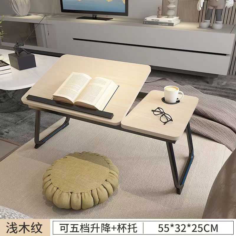 ベッドの上のノートパソコンの机は折りたたみができます。|undefined
