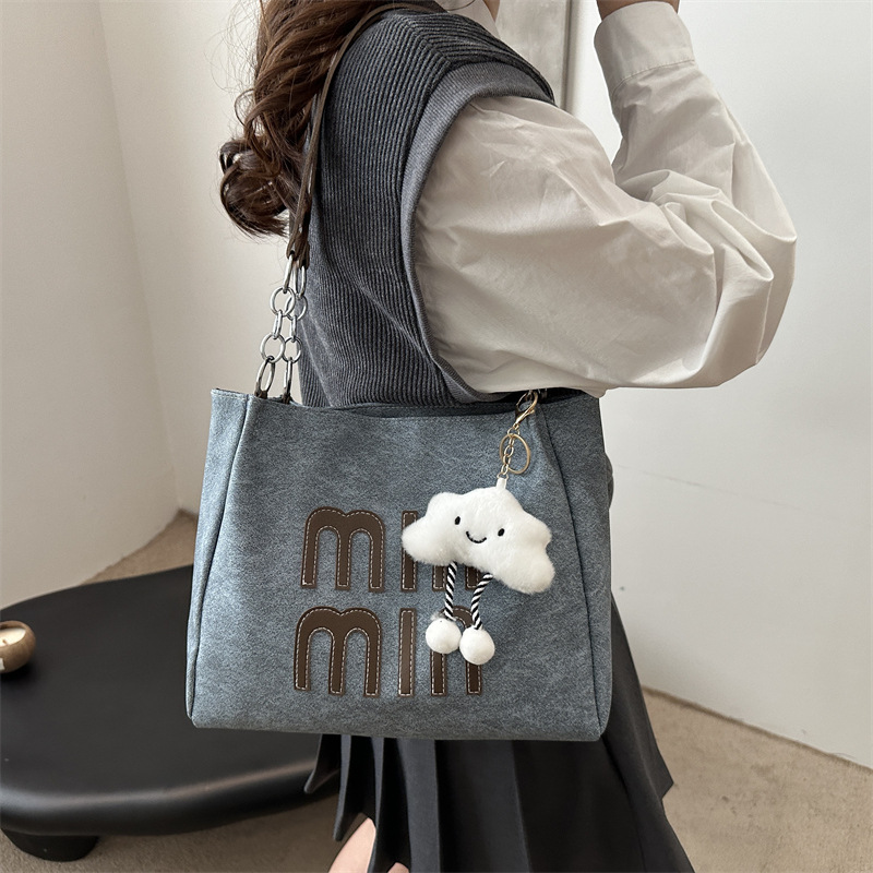 Este año, la versión coreana retro popular bolso de brazo para mujeres 2024 nueva moda bolso de mano casual personalidad textura bolso especial